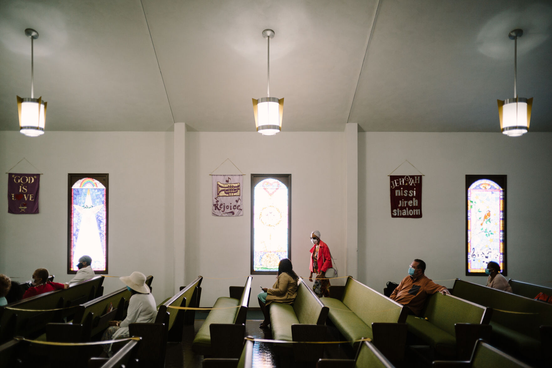 Members of the congregation listen to Rev. Rodrick Williams Sr.